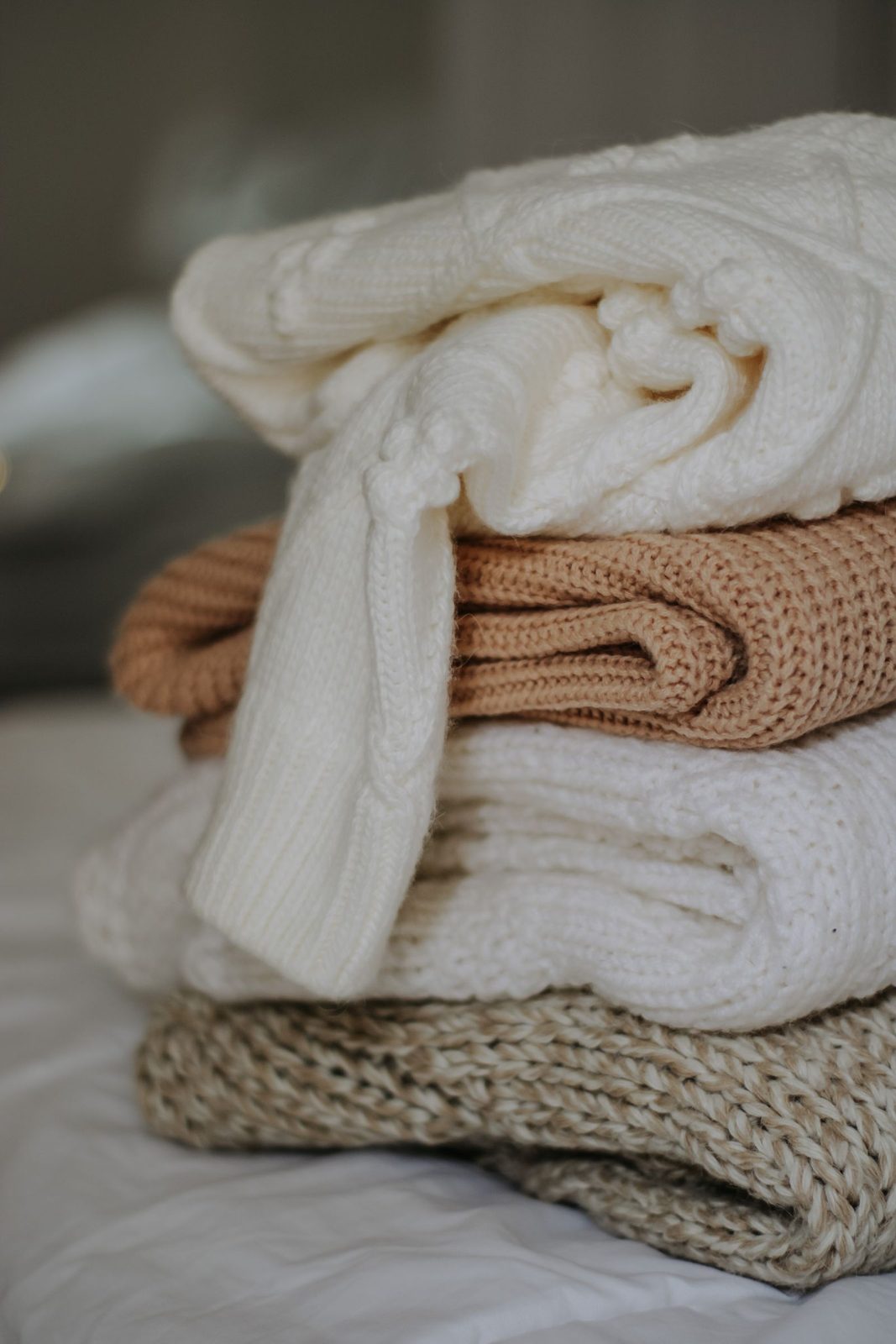 Stack of folded plain knit garments