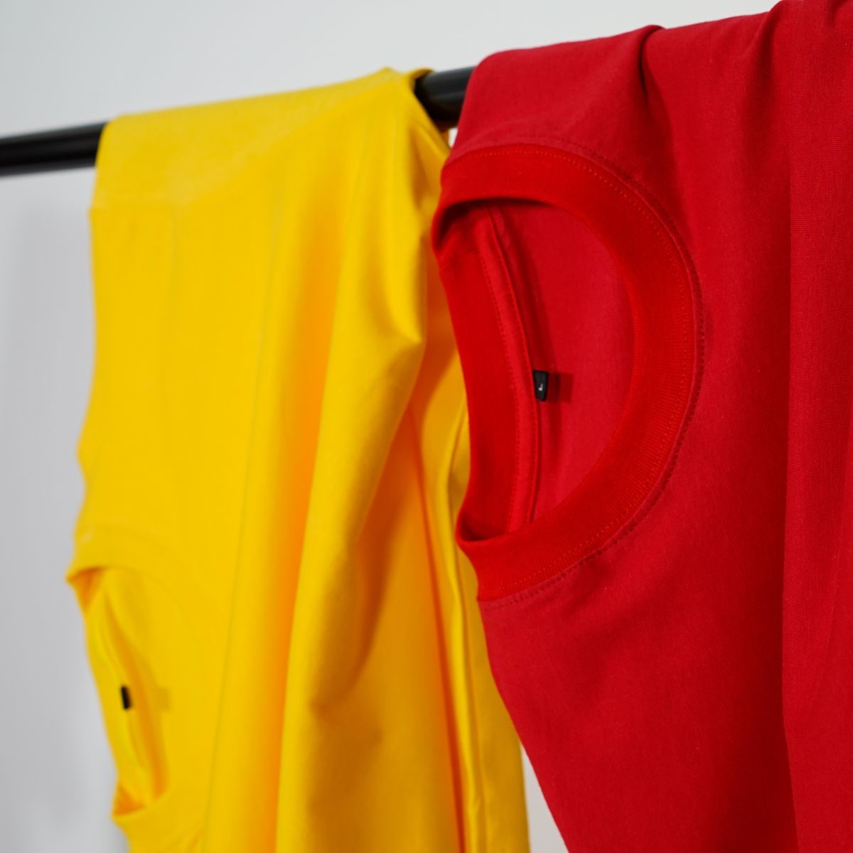 Blank sports shirts on a rail, the surface player numbers are applied to