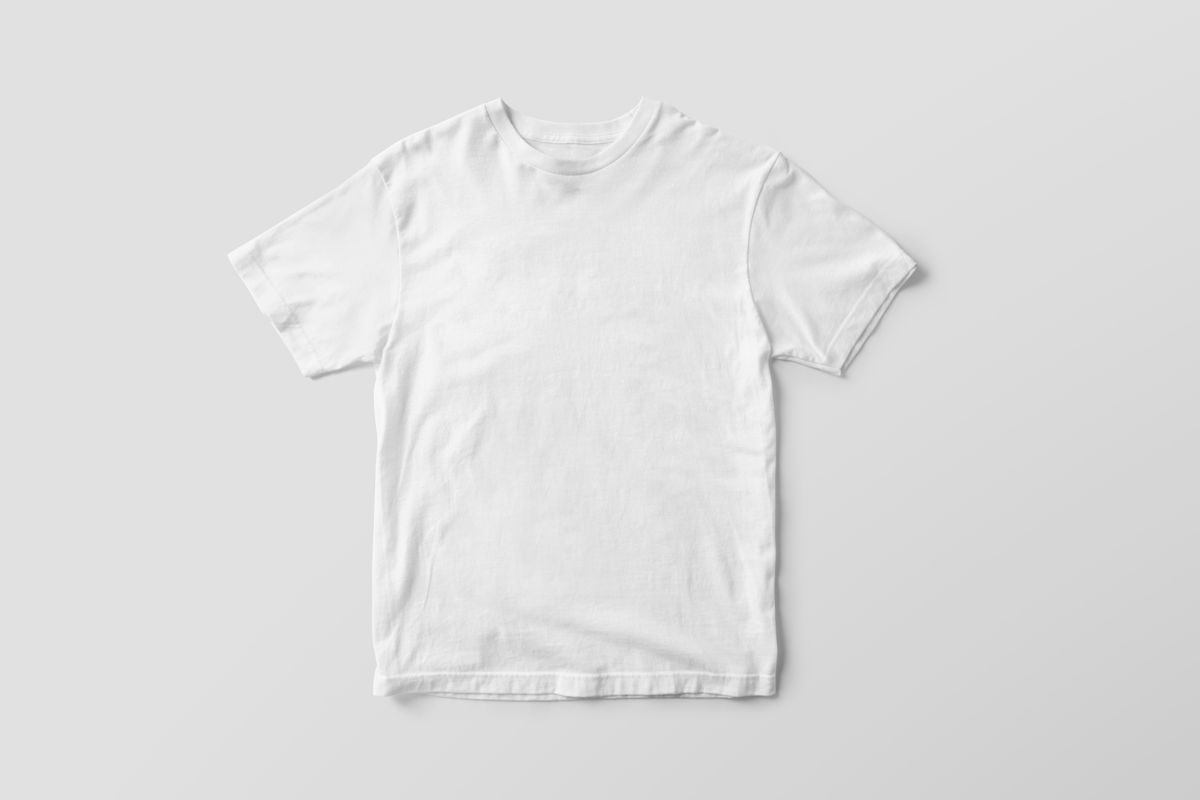 Blank white shirt laid flat on a light background