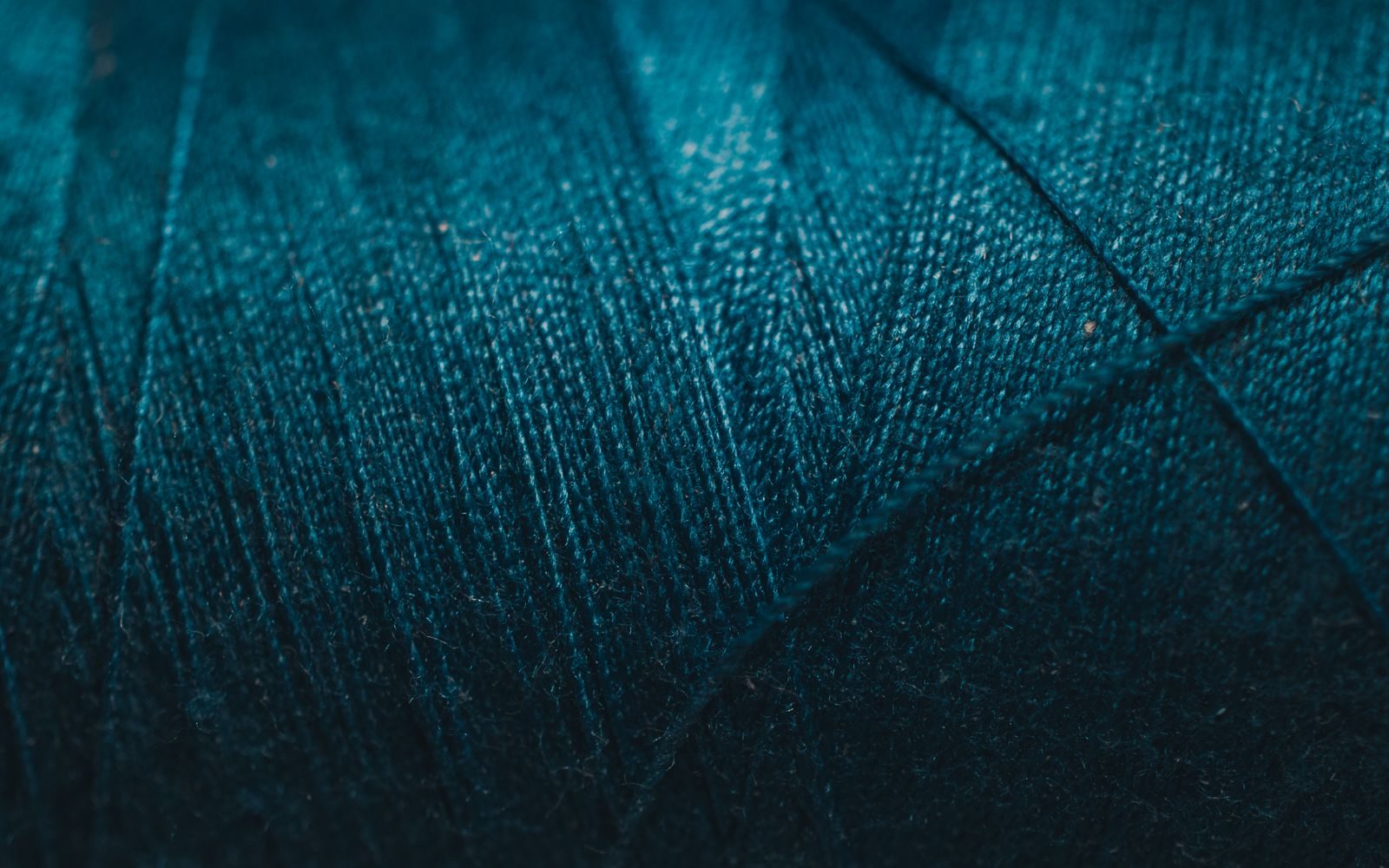Macro view of sewing thread wound on a spool