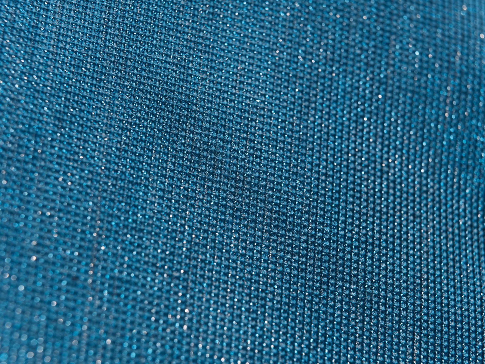 Close-up of technical woven polyester with a subtle sheen